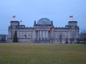 Buildings in city against clear sky