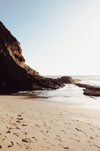 Scenic view of beach against clear sky