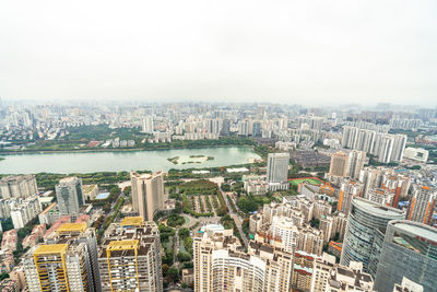 High angle view of city buildings against sky