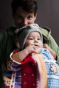 Portrait of father with baby at home