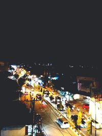 High angle view of illuminated city street at night