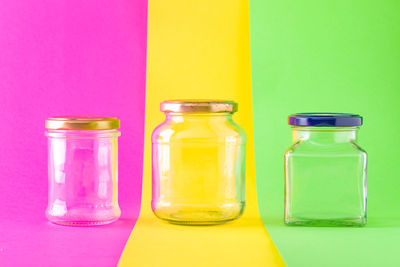 Close-up of glass of bottles on table