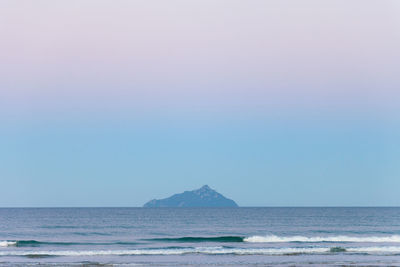 Scenic view of beach against clear sky