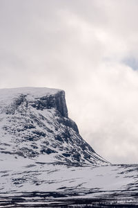 Scenic view of snow covered mountain against sky