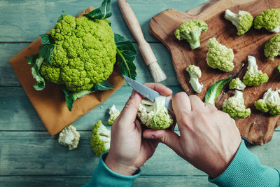 High angle view of person preparing food on table