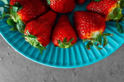 Strawberries on blue plate