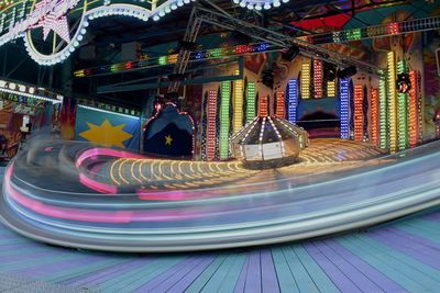 Close-up of illuminated carousel in amusement park