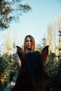 Portrait of woman against sky