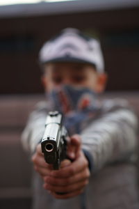 Boy aiming gun