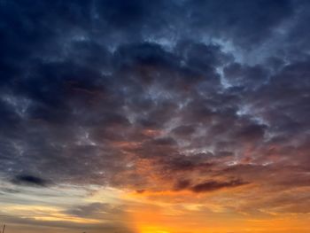 Low angle view of dramatic sky during sunset