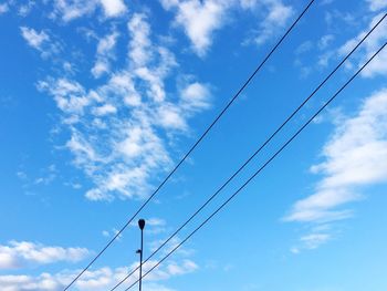 Power cable against sky