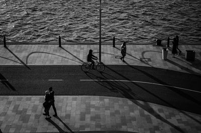 High angle view of people riding bicycle on street