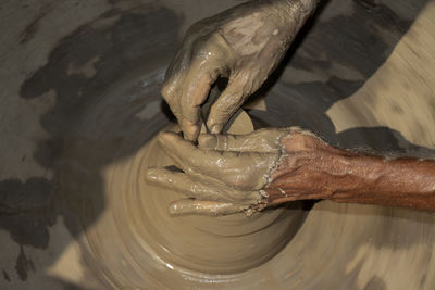 Cropped hand of person preparing food