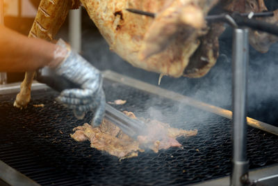 Man preparing food on barbecue grill