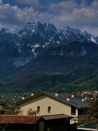 High angle view of townscape and mountains against sky