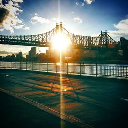 Sun shining through bridge