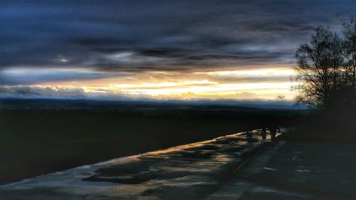 Scenic view of road against sky during sunset