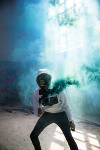 Full length of man holding camera