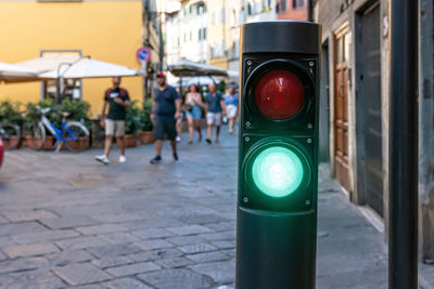 Polar with red or green lights that control the flow of traffic in the historic center of florence