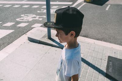 Boy standing on street