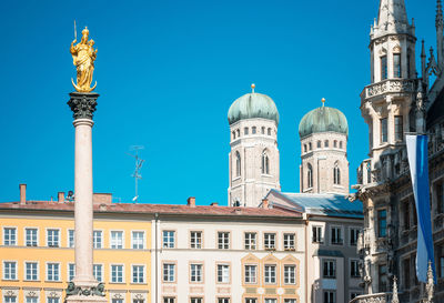 Low angle view of building against clear blue sky