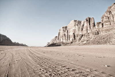 Scenic view of desert against clear sky