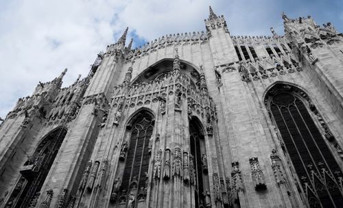 Low angle view of duomo di milano in city