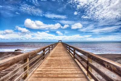 Pier over sea against sky