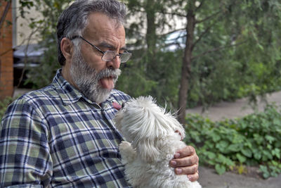 Portrait of man with dog