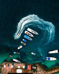 Aerial view of boats moored in sea
