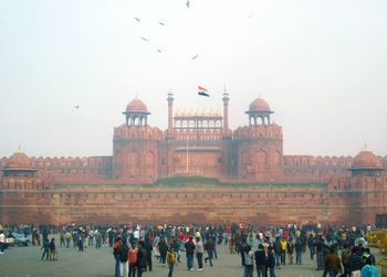 People at town square against clear sky
