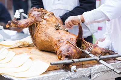 Man preparing food on barbecue grill