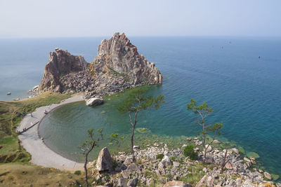 High angle view of rocks on beach against sky