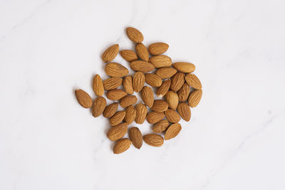 Close-up of roasted coffee beans on white background