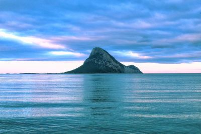 Scenic view of sea against sky at sunset