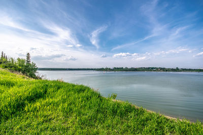 Summer scenic views of lake against sky at the glenmore reservoir in calgary, alberta.