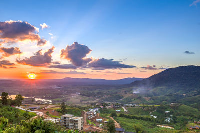 Aerial view of townscape against sky during sunset