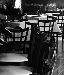 Empty chairs and tables in cafe