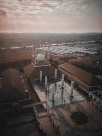 High angle view of cityscape against sky during sunset at the masjid agung jawa tengah