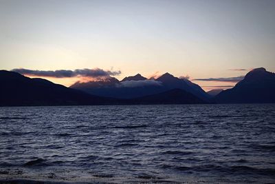 Scenic view of sea against sky at sunset