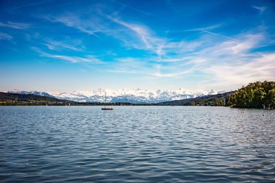 Scenic view of lake against sky during sunset