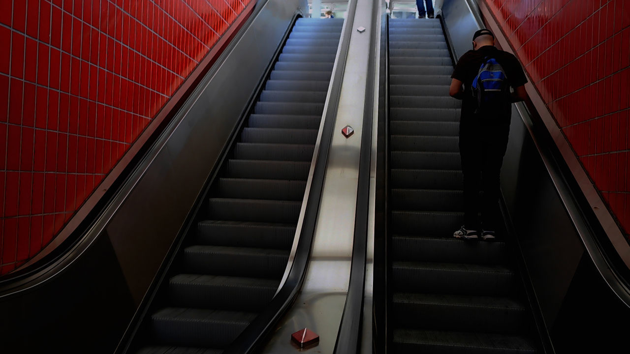 HIGH ANGLE VIEW OF ESCALATOR AT SUBWAY