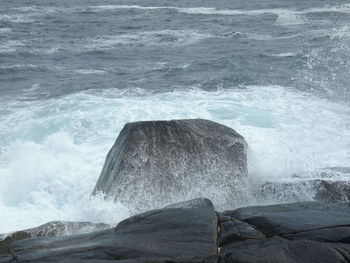 Sea waves splashing on rocks