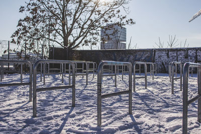 View of playground against clear sky at park during winter