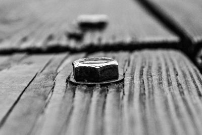 Close-up of rusty metal on wood