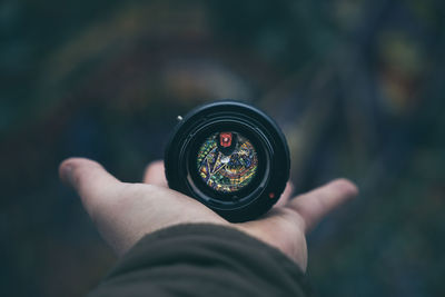 Close-up of hand holding camera