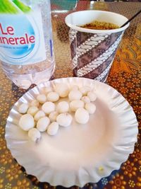 High angle view of eggs in glass on table