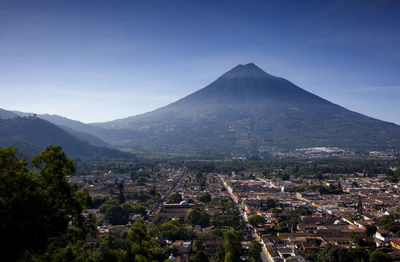 Scenic view of mountains against clear blue sky