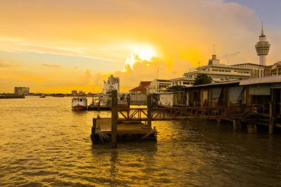 Scenic view of river against sky during sunset