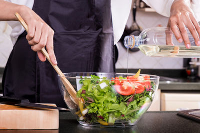 Woman preparing food in kitchen at home